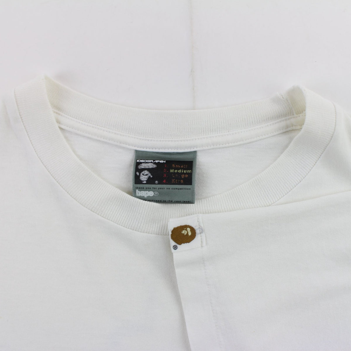 Bape Bapesta puzzle dino Text Logo Tee White - SARUUK